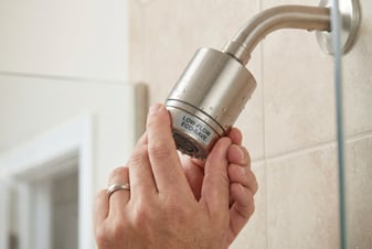 Plumber installing a new bathroom fixture